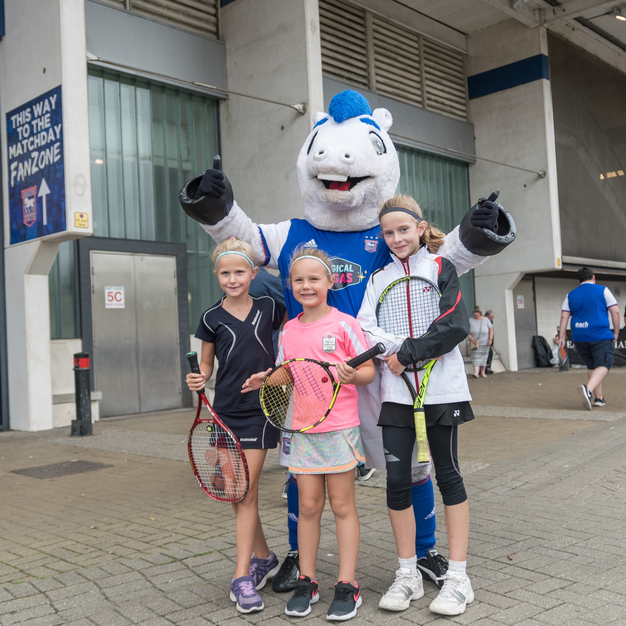 Young Foundation-supported players pose for a photo with Ipswich Town mascot Bluey during Saturday's collection.