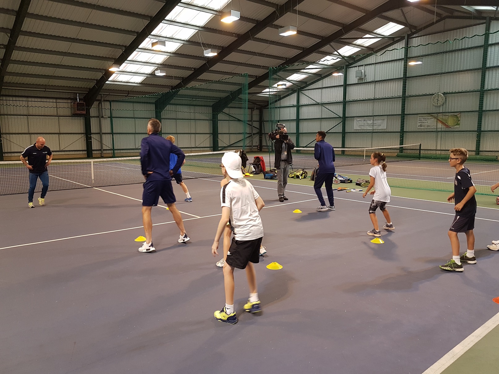 Strength and conditioning coach Wes Pooley puts the players through their paces through the warm-up during the visit of Ipswich Town FC players Cole Skuse and Andre Dozzell.